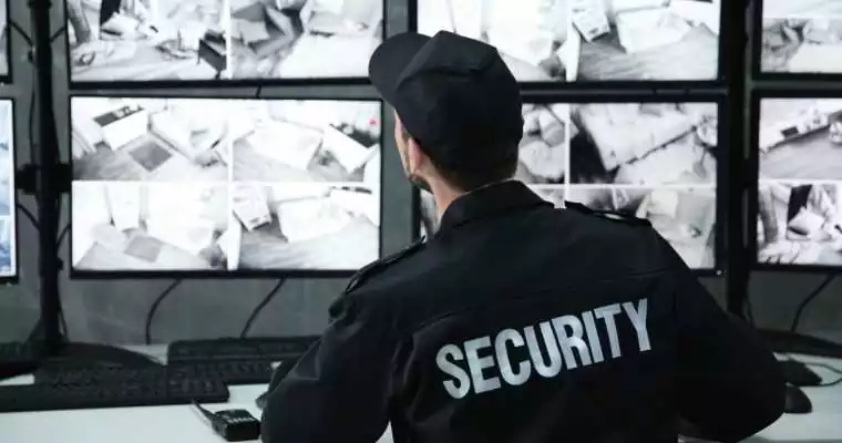 security guard checking cameras