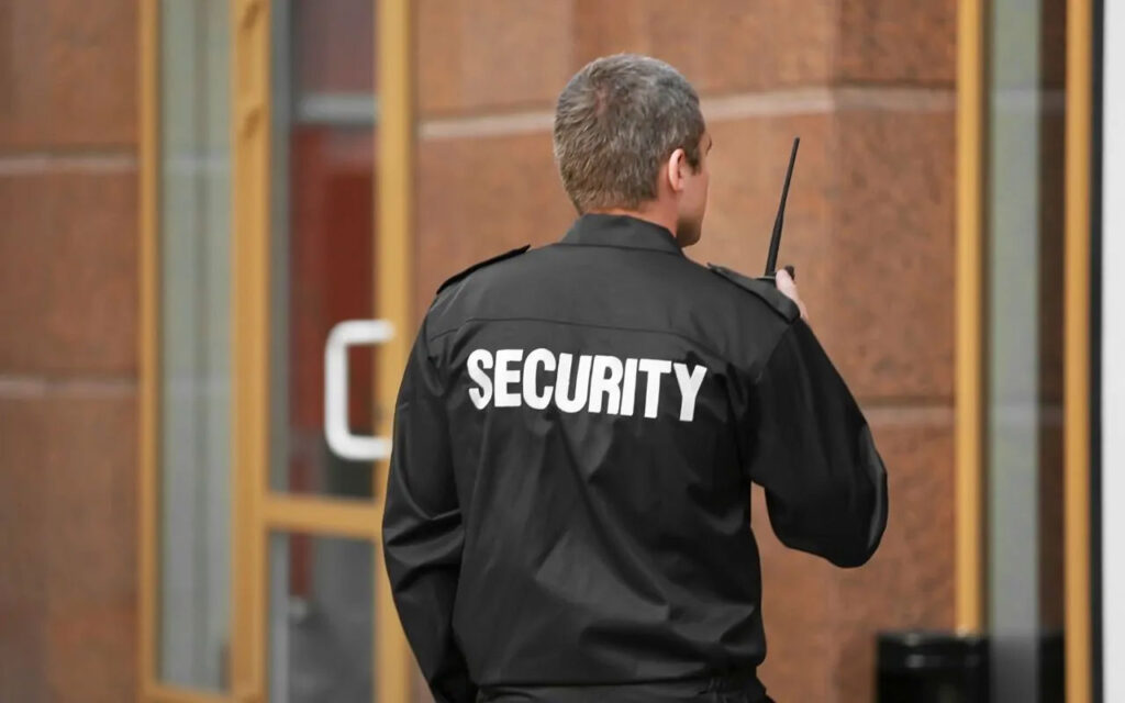 A vigilant security officer ensuring safety at a bustling Houston shopping center.