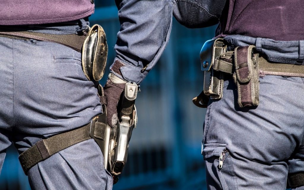 Armed and unarmed security guards standing side-by-side in Houston