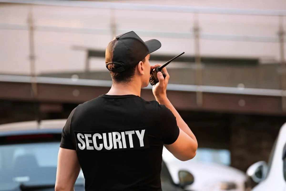 Security guard answering the radio call.