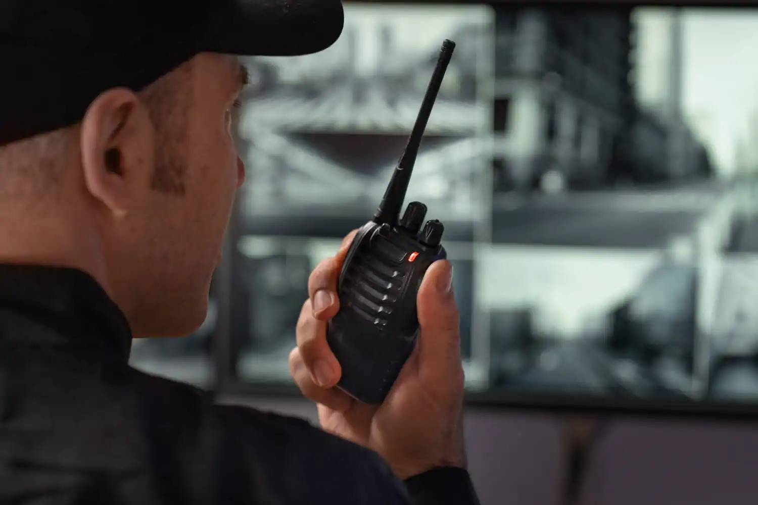 Security guard talking to someone on walkie-talkie
