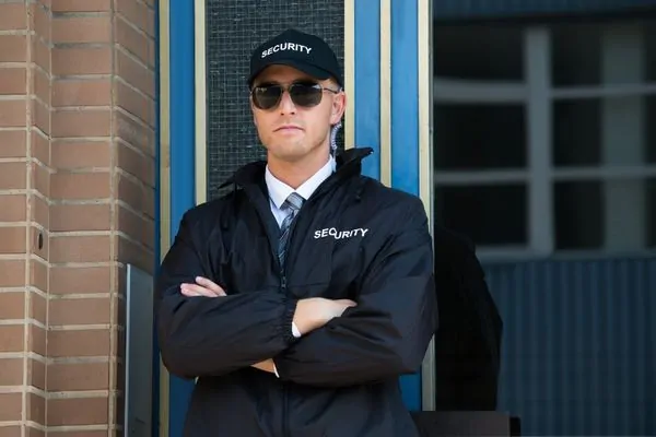 Security guard monitoring building entrance