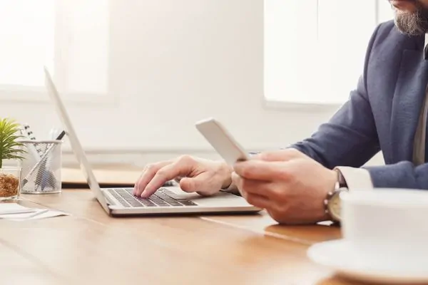 Businessman researching reliable security guard providers