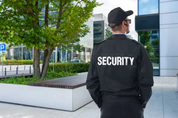 Uniformed security guard standing on duty