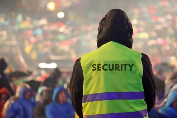 Guard overseeing crowd control at event