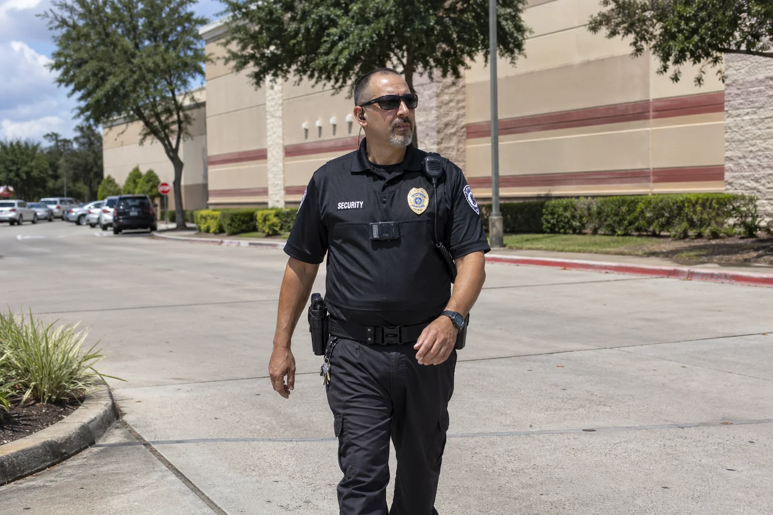 a security guard patrolling around the building