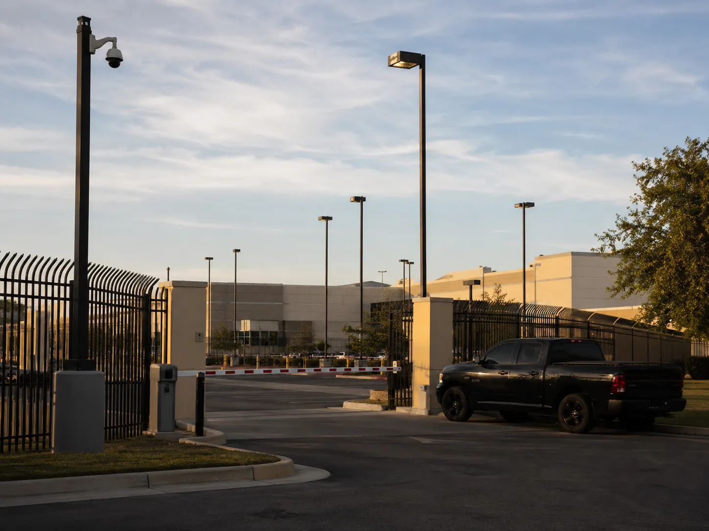 Secure industrial entrance at sunset