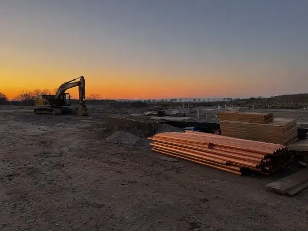 Deserted Houston construction site with idle equipment after hours