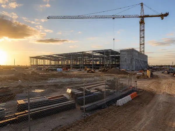 Data center under construction near Houston with temporary perimeter fencing